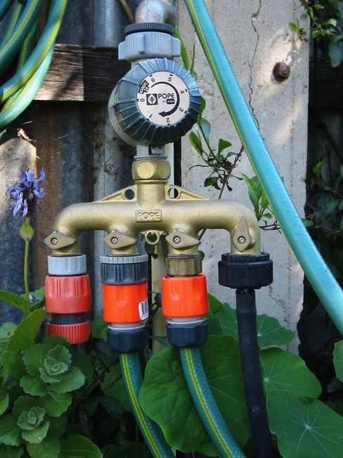 A four-way brass tap and timer