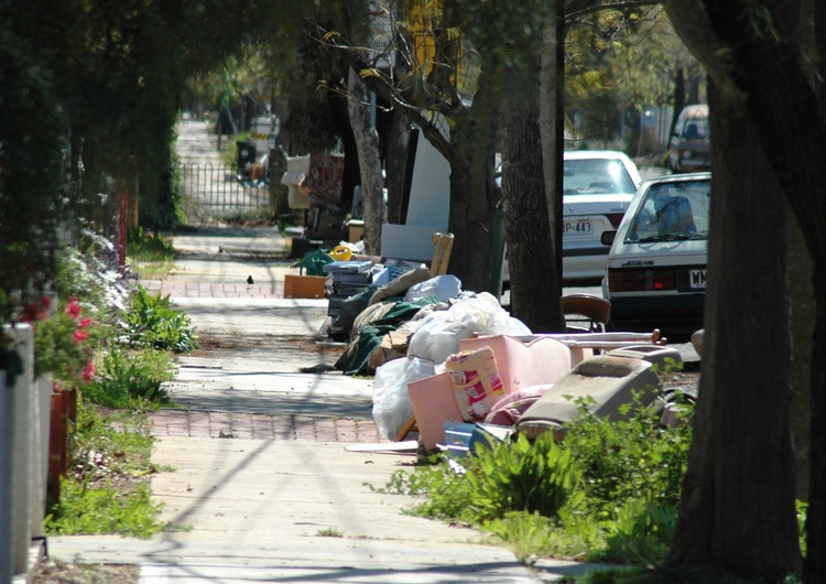 Street lined with other people's rubbish