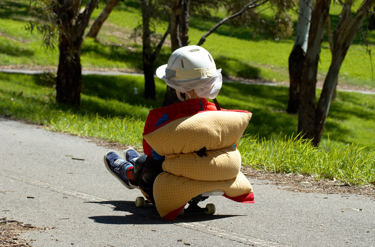 Michael rolling downhill on his skateboard