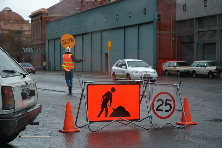 A roadworker and his signs