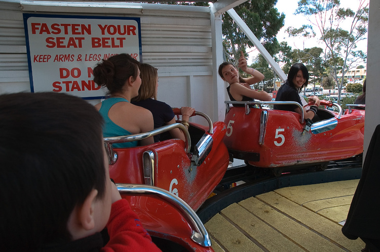 Waiting in roller-coaster cars for the ride to begin