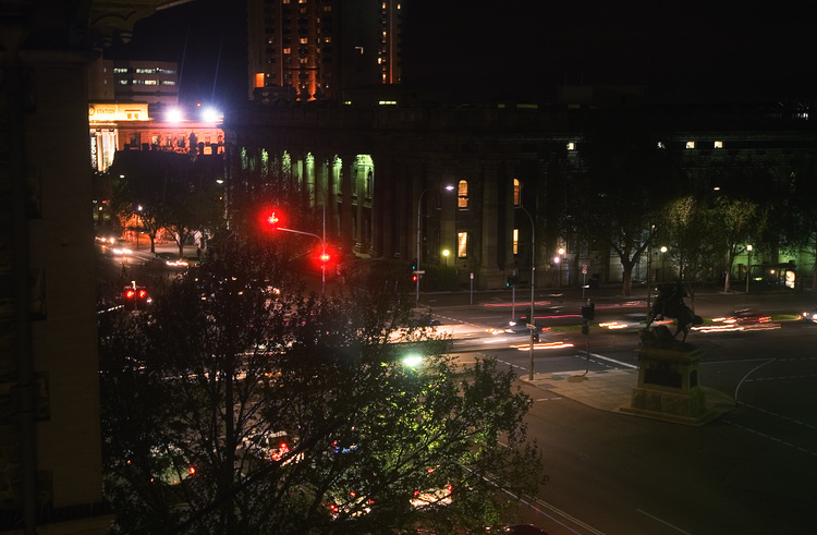 The corner of North Terrace and King William St, by night