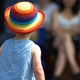 Small child in a brightly coloured hat