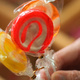 Three lollipops being held by a hand
