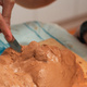 Sculpting a face, in clay