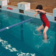 Michael, jumping into a swimming pool